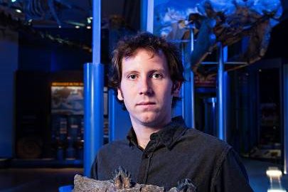 Dr Matthew McCurry with a piece of a jaw from one of one of the fossil whales used in the study.