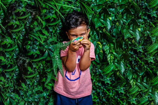 Young child with painted frog